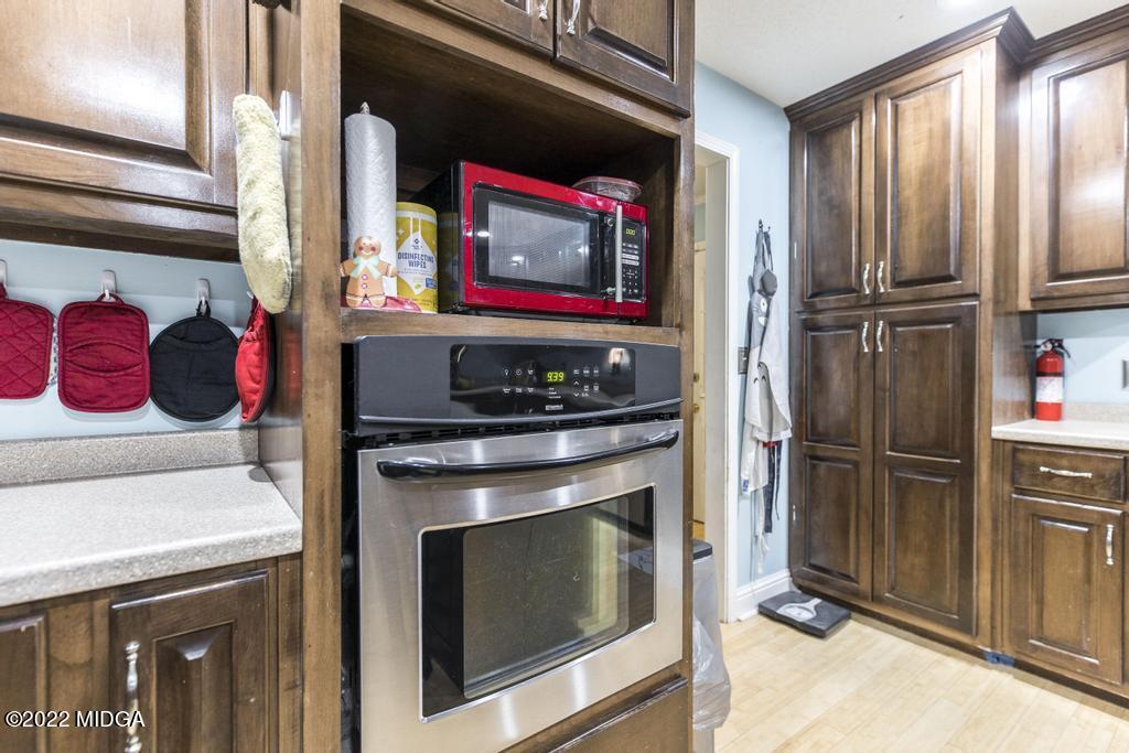 115 Coley Lake Road Macon, GA 31216 - Photo 20 of 42 a kitchen with stainless steel appliances granite countertop a refrigerator and a stove