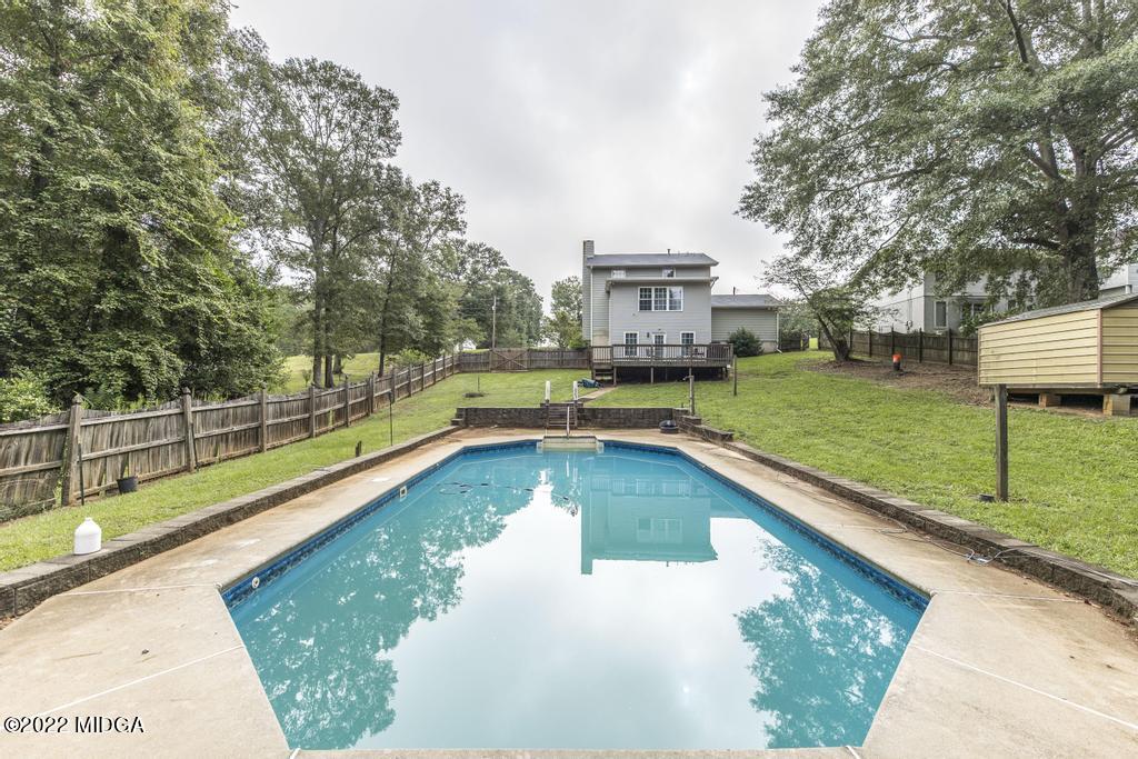 115 Coley Lake Road Macon, GA 31216 - Photo 2 of 42 a view of a swimming pool with a patio