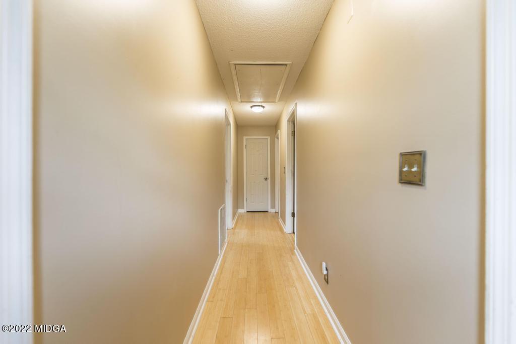 115 Coley Lake Road Macon, GA 31216 - Photo 24 of 42 a view of a hallway with wooden floor