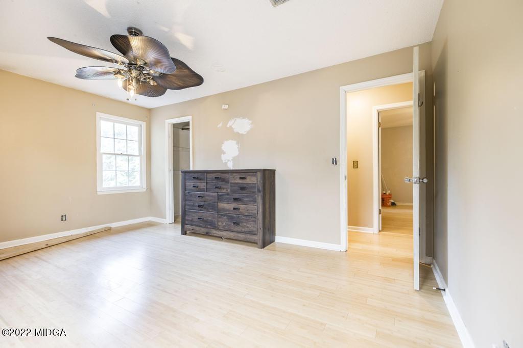 115 Coley Lake Road Macon, GA 31216 - Photo 27 of 42 wooden floor in an empty room with a window