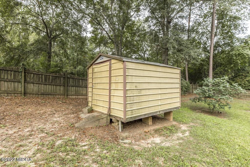 115 Coley Lake Road Macon, GA 31216 - Photo 40 of 42 a view of a backyard with wooden fence
