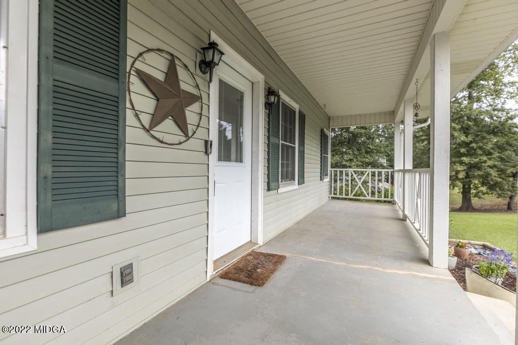 115 Coley Lake Road Macon, GA 31216 - Photo 4 of 42 a view of a door and chair in the balcony