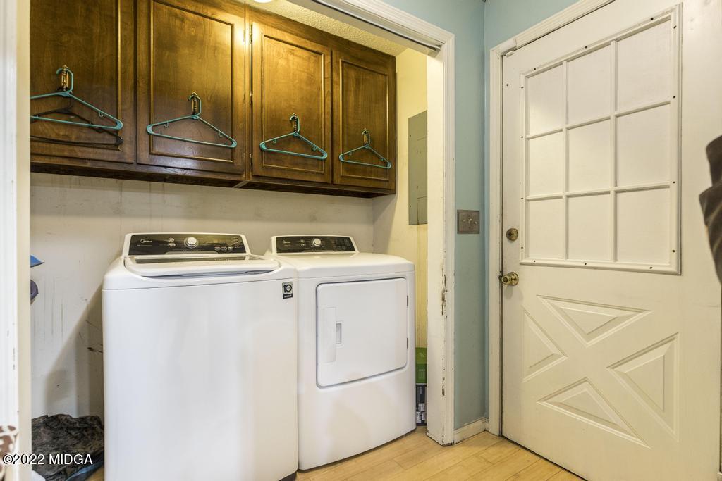 115 Coley Lake Road Macon, GA 31216 - Photo 9 of 42 a view of storage and utility room with washer and dryer