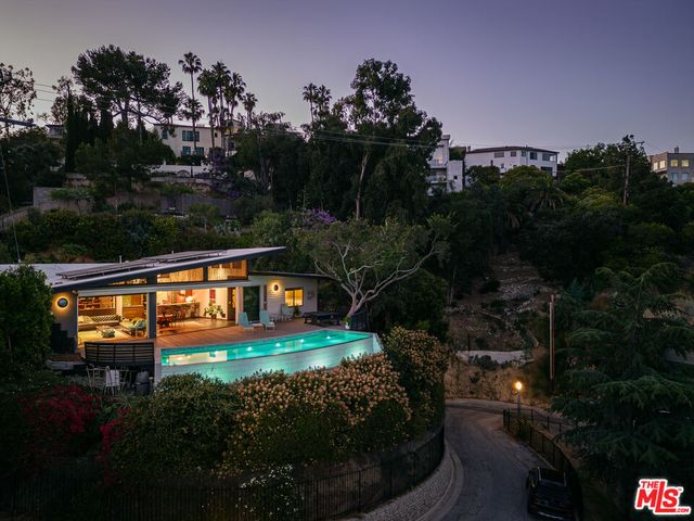 a view of swimming pool from a outdoor seating