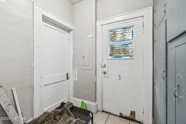 a view of a bathroom from a hallway