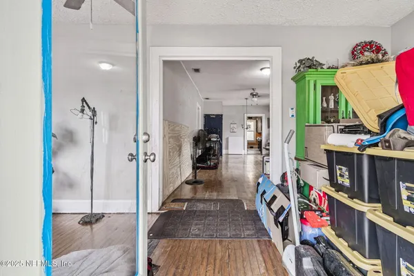 a view of an entryway with wooden floor