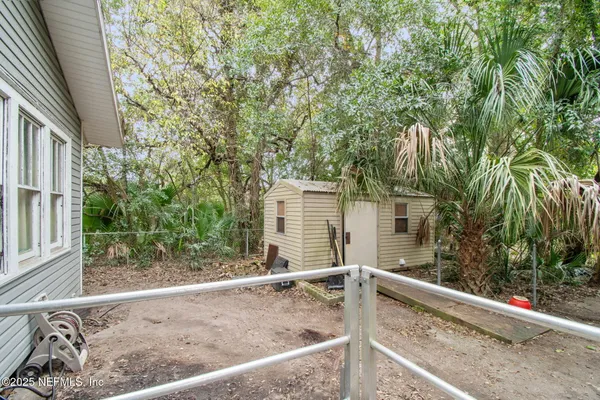 a view of a backyard with sitting area