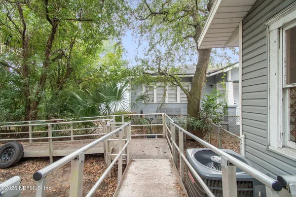 a view of a backyard with trees