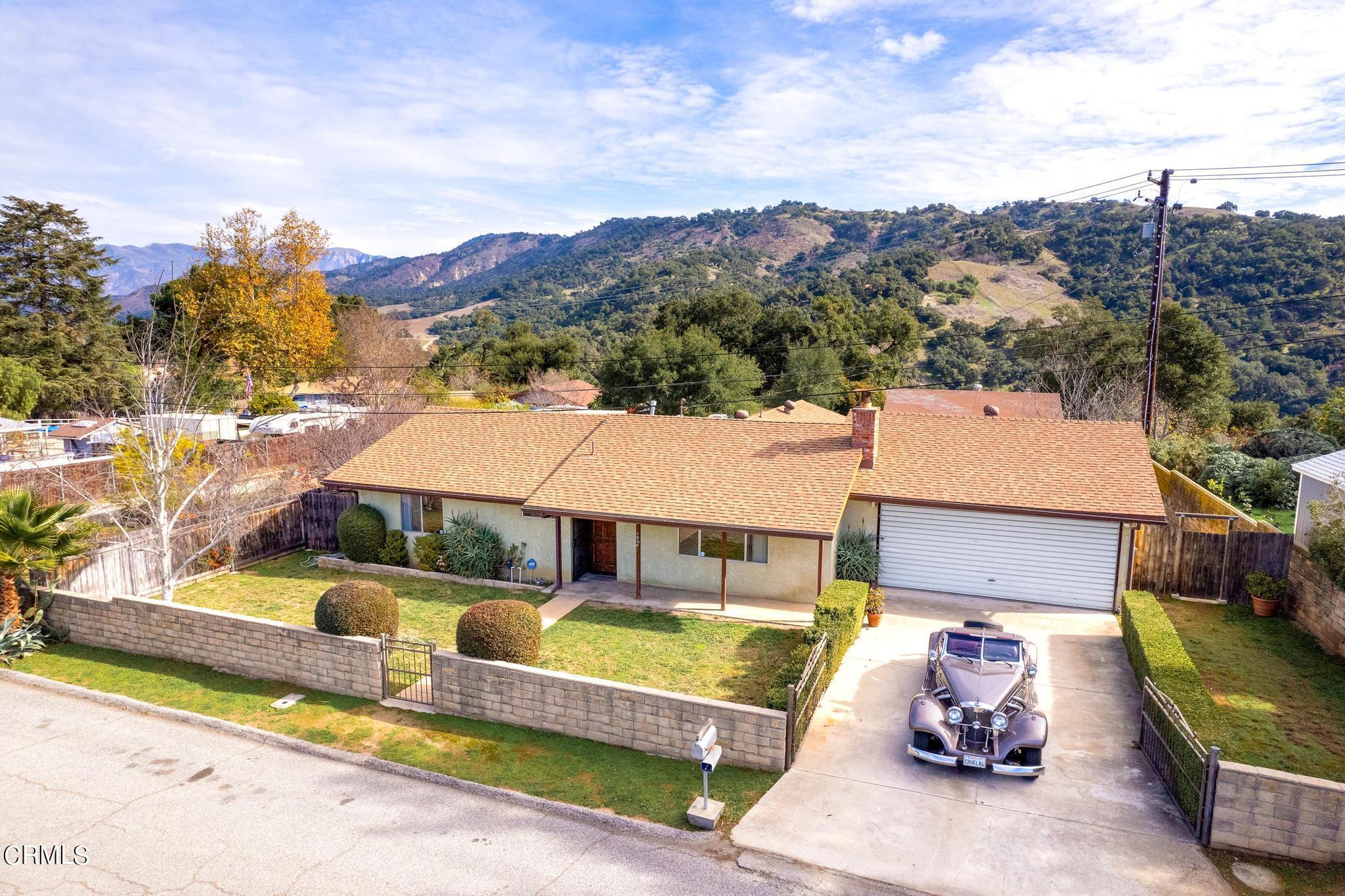 1060 Spring Street Oak View, CA 93022 - Photo 1 of 33 an aerial view of a house with swimming pool and a yard