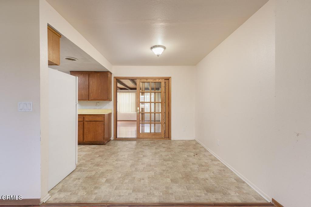 1060 Spring Street Oak View, CA 93022 - Photo 11 of 33 a view of an empty room with a kitchen and a window