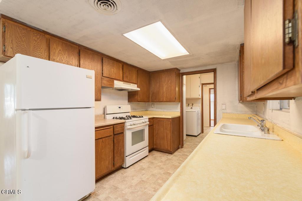 1060 Spring Street Oak View, CA 93022 - Photo 13 of 33 a kitchen with stainless steel appliances granite countertop a refrigerator a stove a sink and a refrigerator