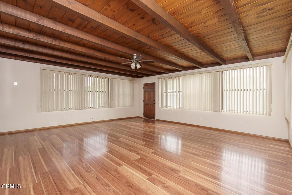 1060 Spring Street Oak View, CA 93022 - Photo 15 of 33 a view of an empty room with wooden floor and a window