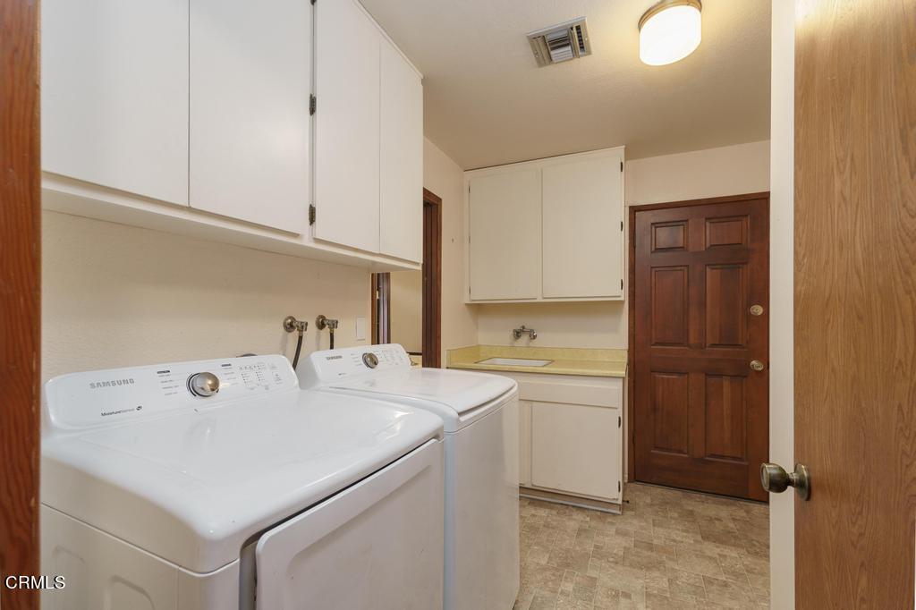 1060 Spring Street Oak View, CA 93022 - Photo 19 of 33 a utility room with sink dryer and washer