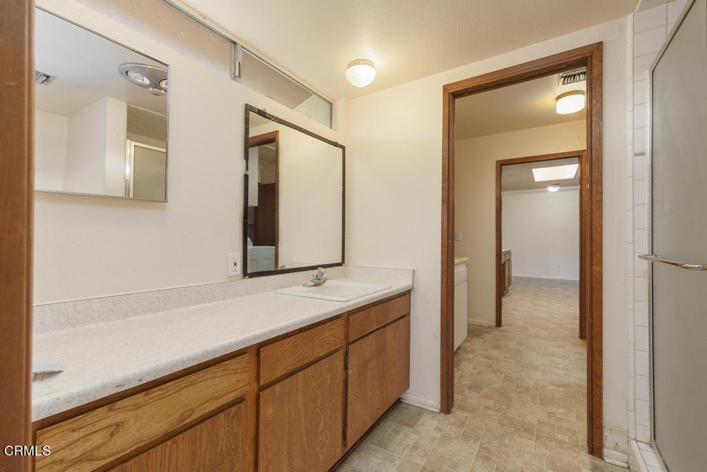 1060 Spring Street Oak View, CA 93022 - Photo 25 of 33 a bathroom with a sink and a mirror