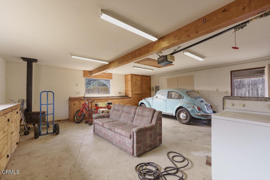1060 Spring Street Oak View, CA 93022 - Photo 32 of 33 a living room with furniture a large window and gym equipment