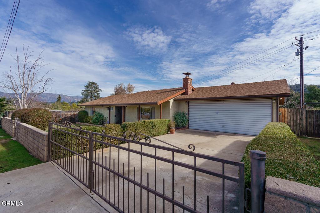 1060 Spring Street Oak View, CA 93022 - Photo 33 of 33 a front view of a house with wooden fence