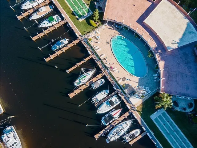 an aerial view of a house a yard and outdoor seating