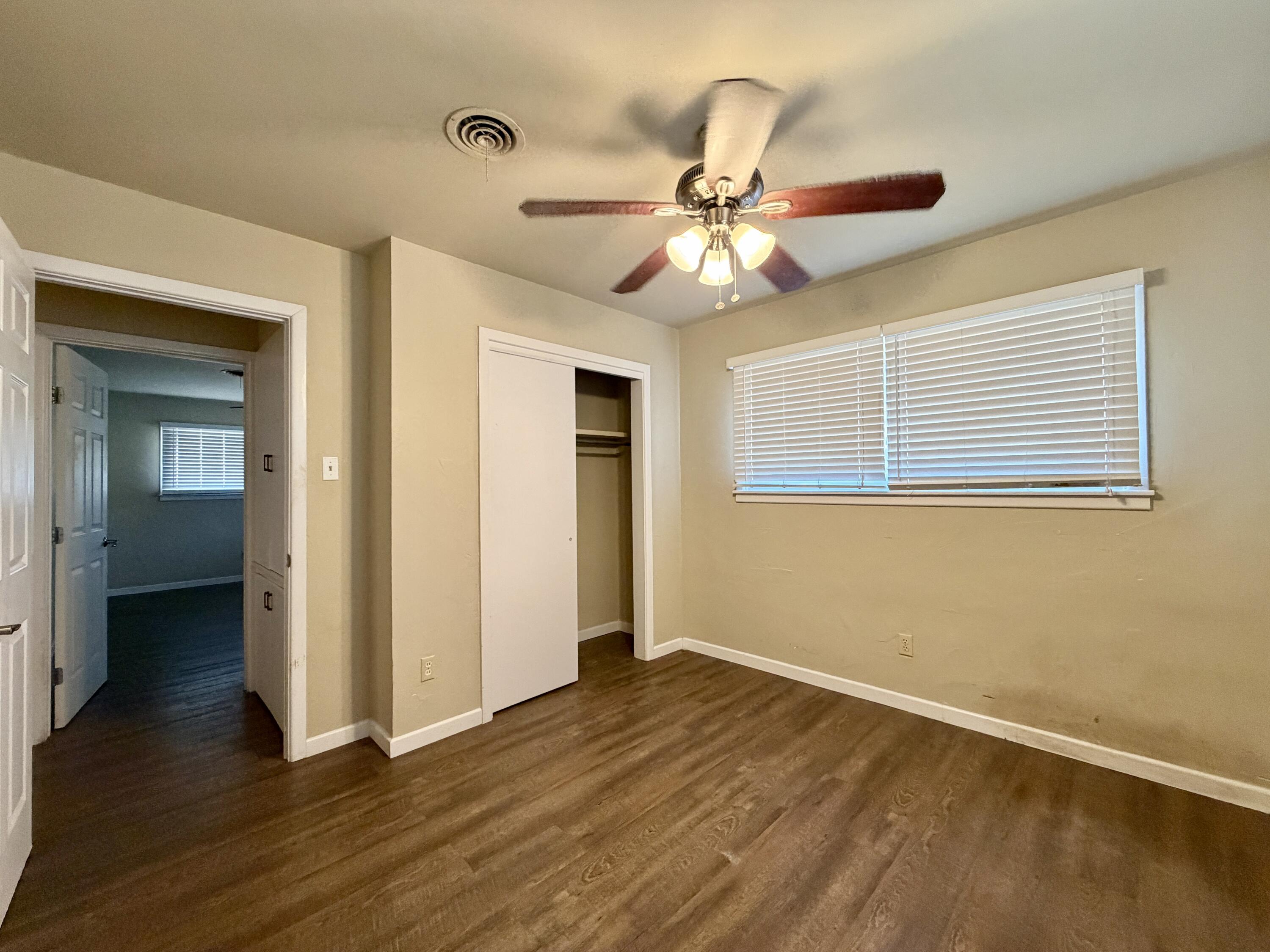 4401 28th Street Lubbock, TX 79410 - Photo 13 of 25 a view of an empty room with wooden floor