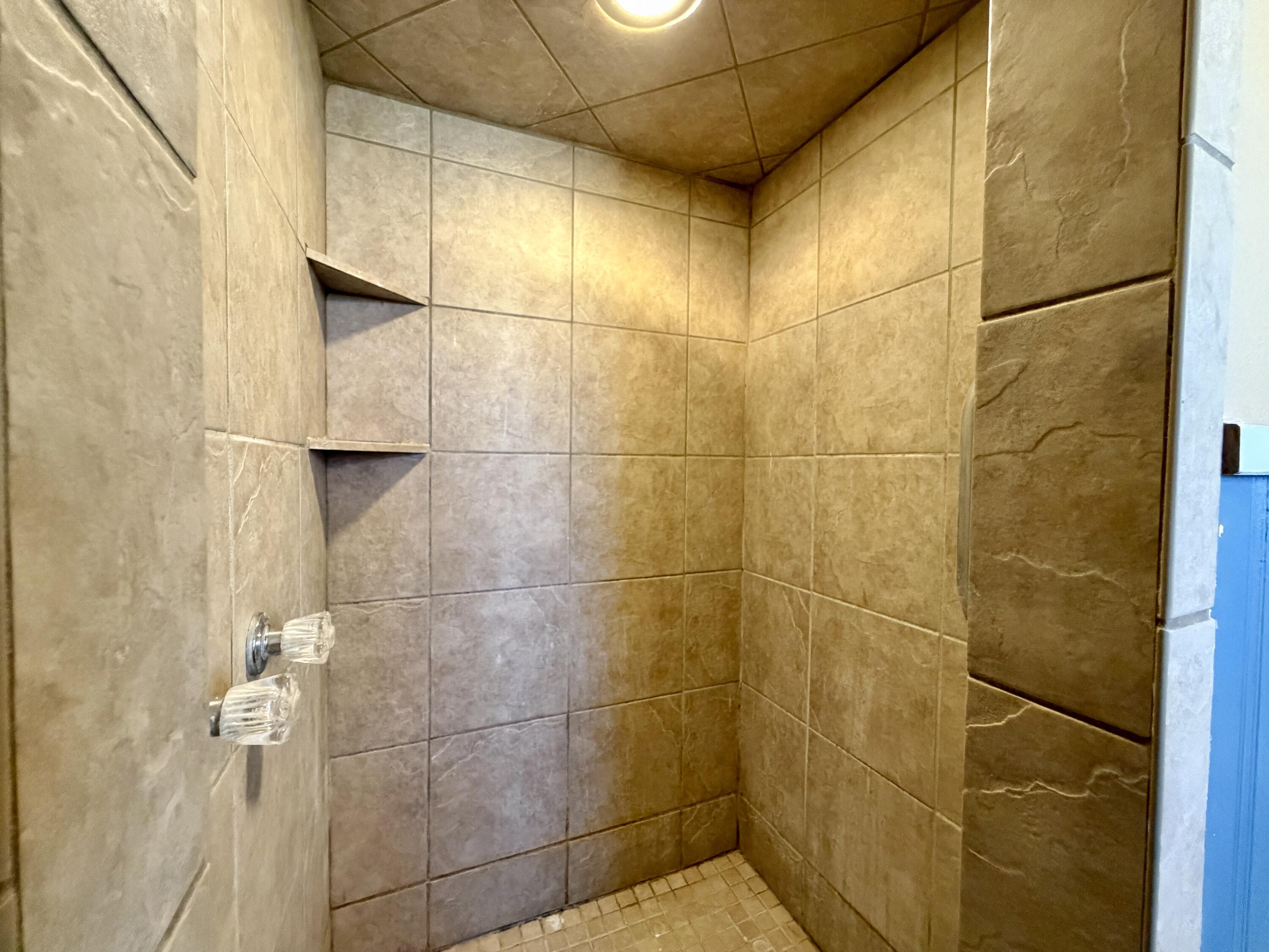 4401 28th Street Lubbock, TX 79410 - Photo 16 of 25 a bathroom with a shower