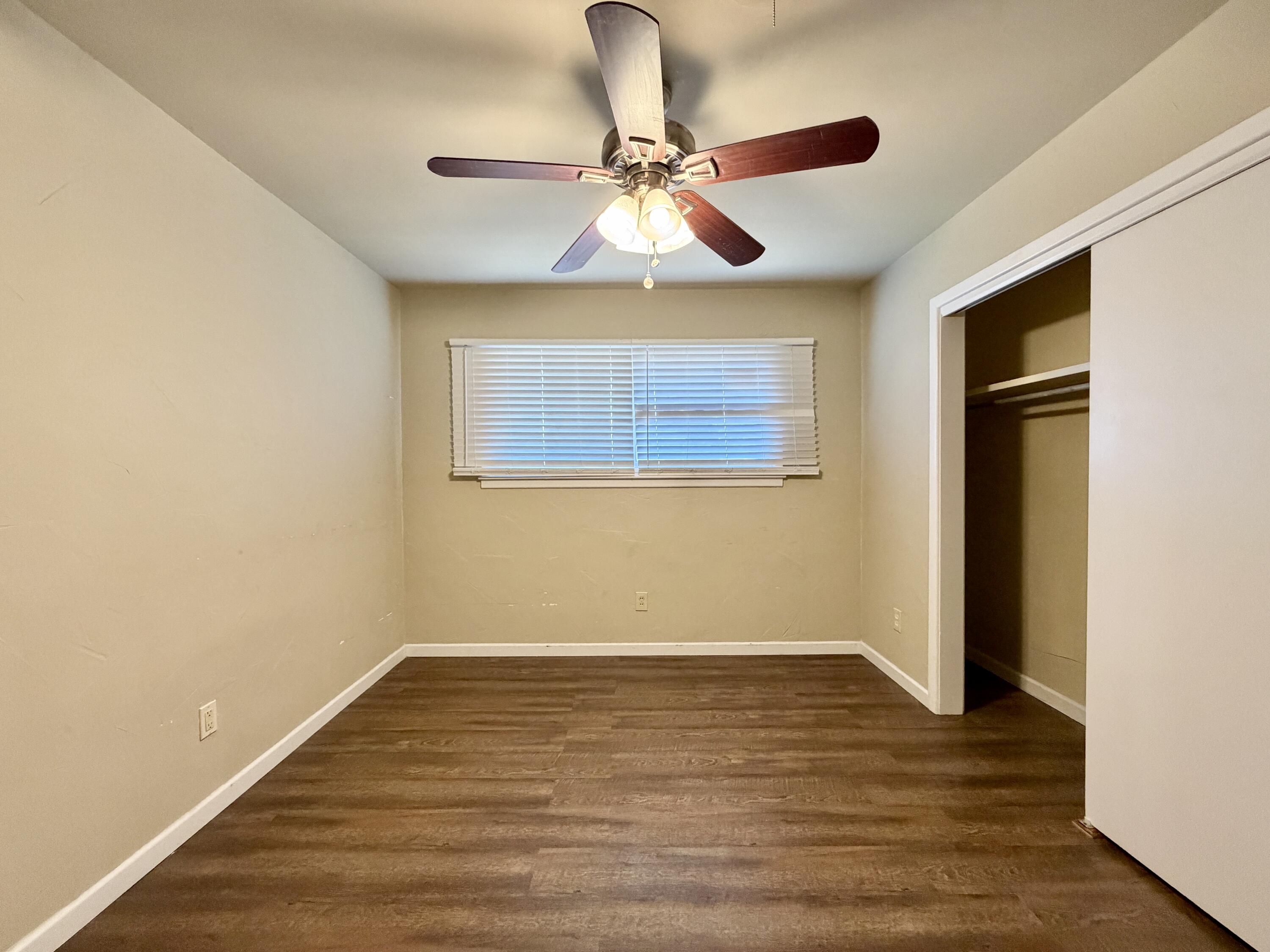 4401 28th Street Lubbock, TX 79410 - Photo 18 of 25 a view of room with wooden floor and fan