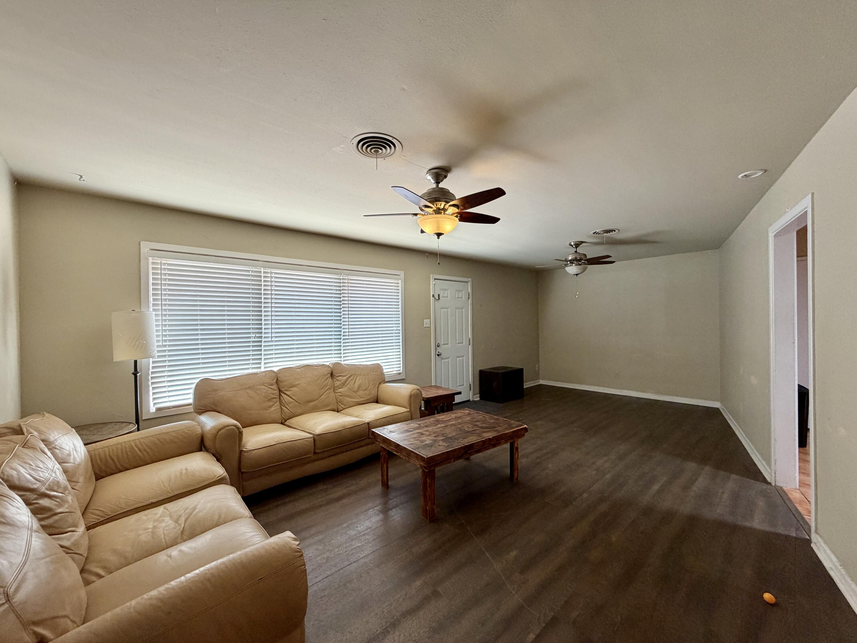 4401 28th Street Lubbock, TX 79410 - Photo 10 of 25 a living room with furniture and a large window