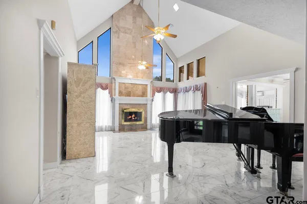 a kitchen with stainless steel appliances granite countertop a sink and a white cabinets