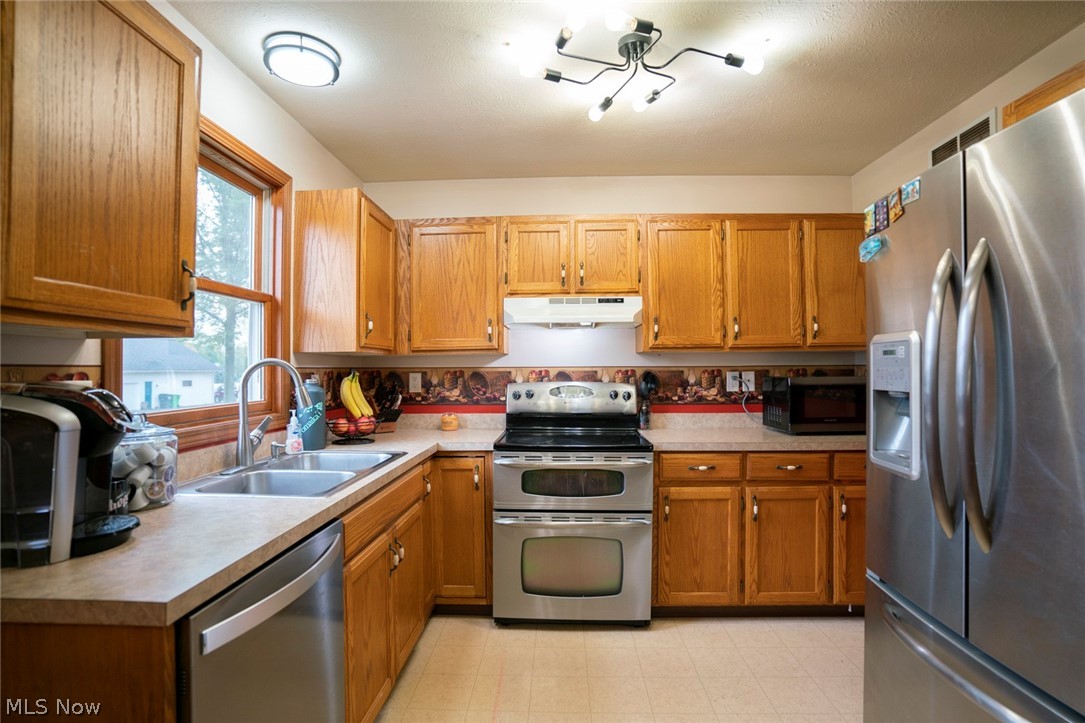 54 Elm Street Rittman, OH 44270 - Photo 15 of 35 Kitchen offers stainless steel appliances. Desirable double oven!