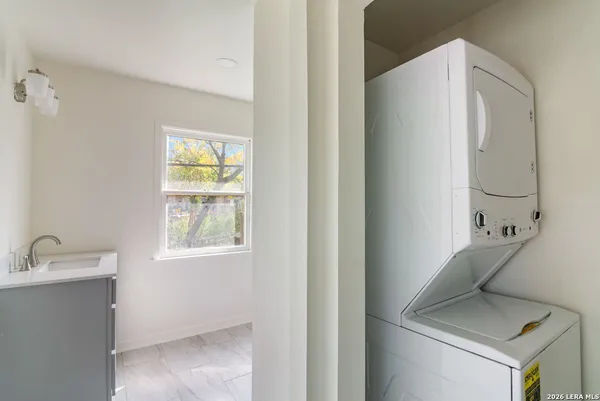 a bathroom with a sink and a window