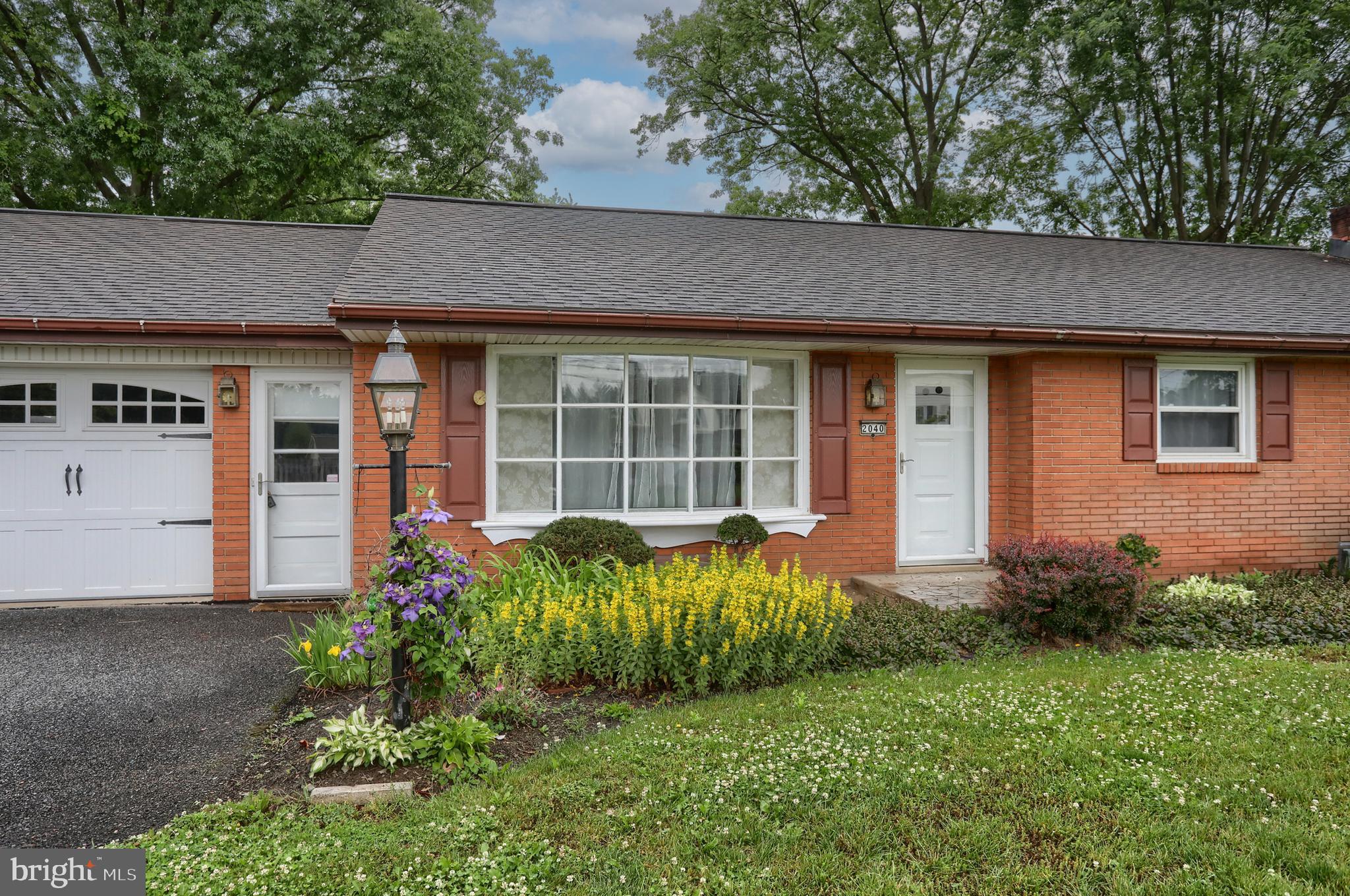 2040 Miller Road East Petersburg, PA 17520 - Photo 25 of 49 a front view of a house with a garden