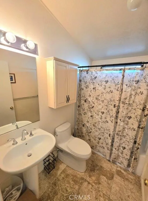 27250 Murrieta Road, Unit 390 Menifee, CA 92586 - Photo 19 of 30 a bathroom with a sink toilet and shower
