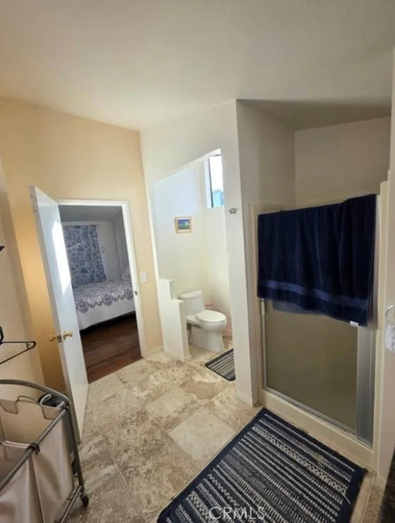 27250 Murrieta Road, Unit 390 Menifee, CA 92586 - Photo 25 of 30 a bathroom with a sink and a shower