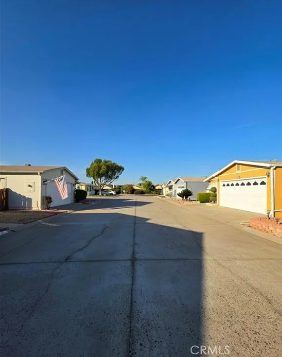 27250 Murrieta Road, Unit 390 Menifee, CA 92586 - Photo 4 of 30 a view of a street with an houses