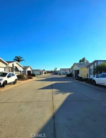 a view of street with parked cars