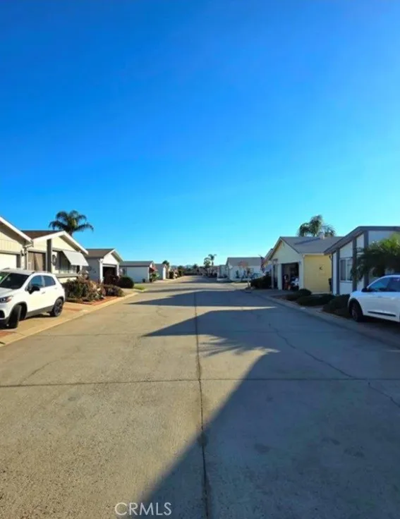 27250 Murrieta Road, Unit 390 Menifee, CA 92586 - Photo 5 of 30 a view of street with parked cars