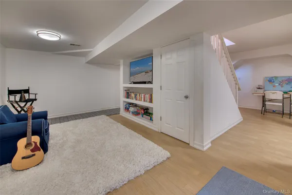 a living room with closet and a couch