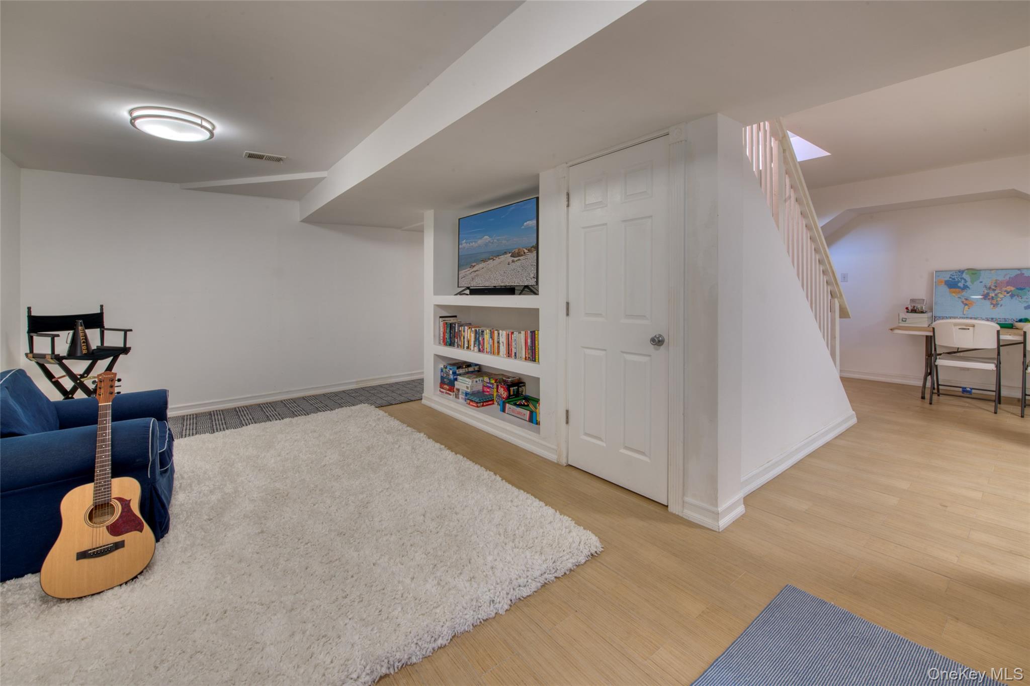 39595 Main Road Orient, NY 11957 - Photo 13 of 15 a living room with closet and a couch