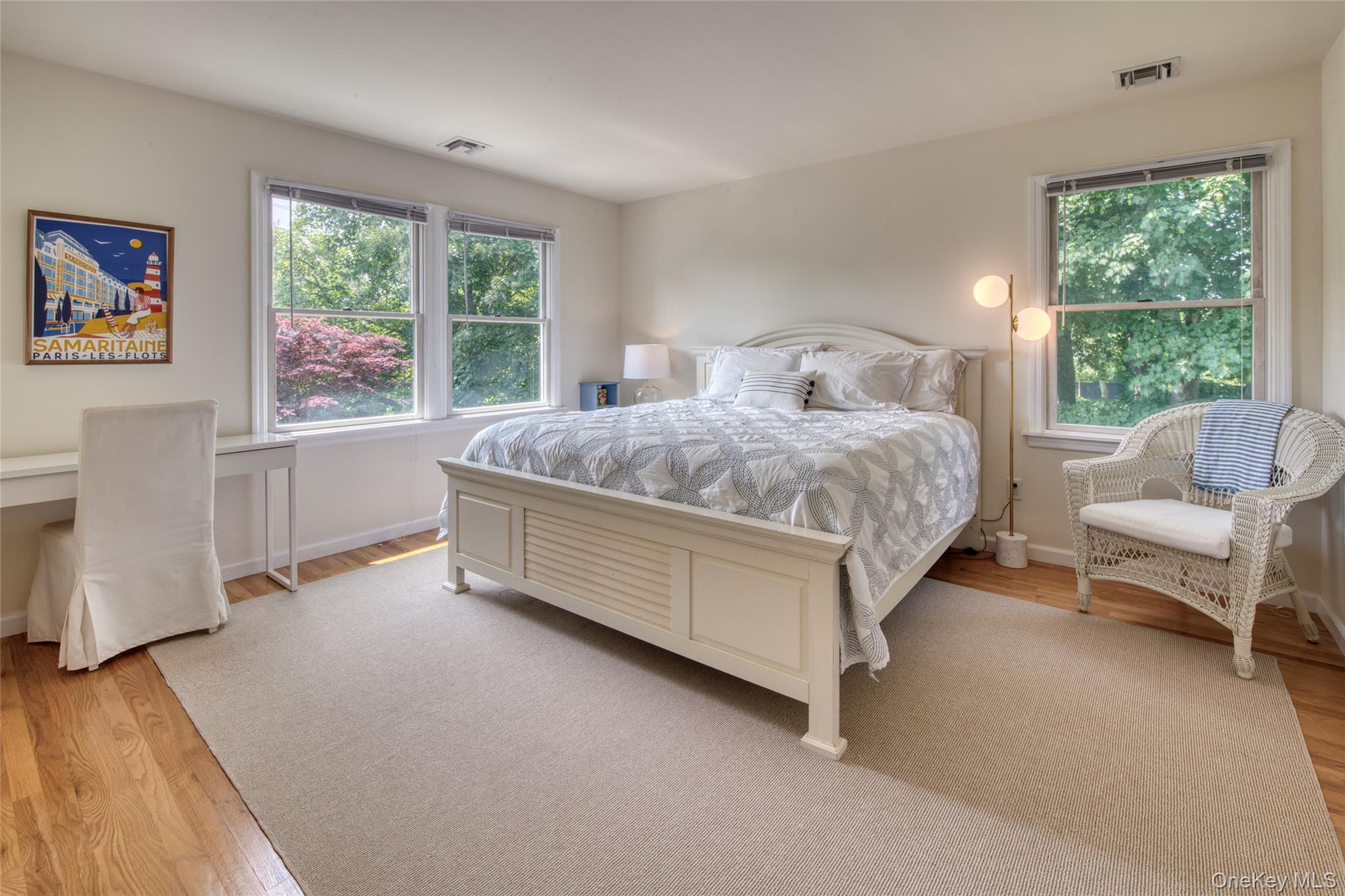 39595 Main Road Orient, NY 11957 - Photo 10 of 15 a spacious bedroom with a bed couch and a window