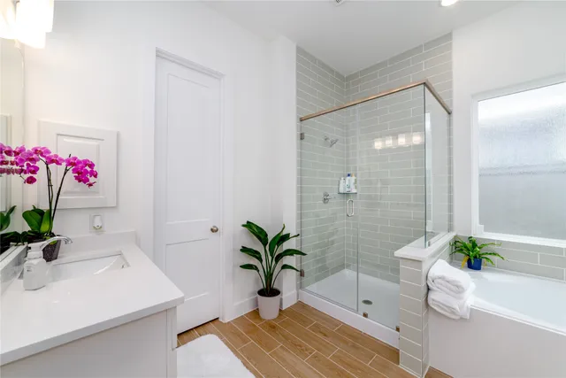 a bath room with a sink and a mirror