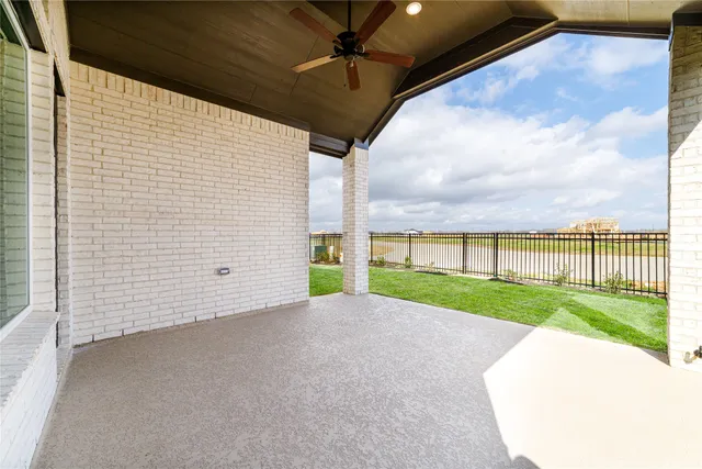 a view of a house with a yard and pathway