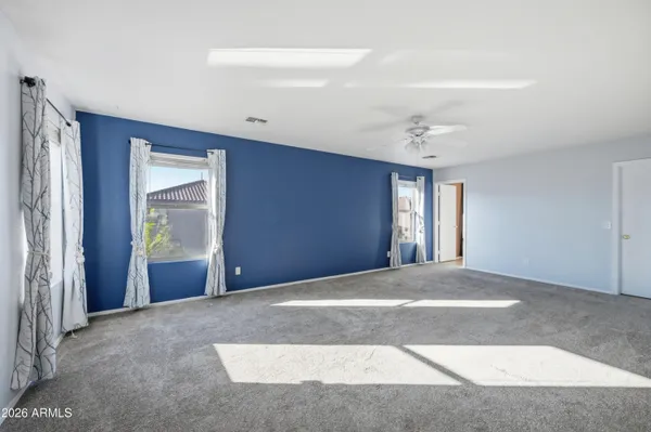 a room with window and ceiling fan