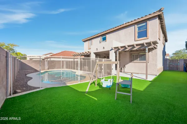 a view of a back yard of the house