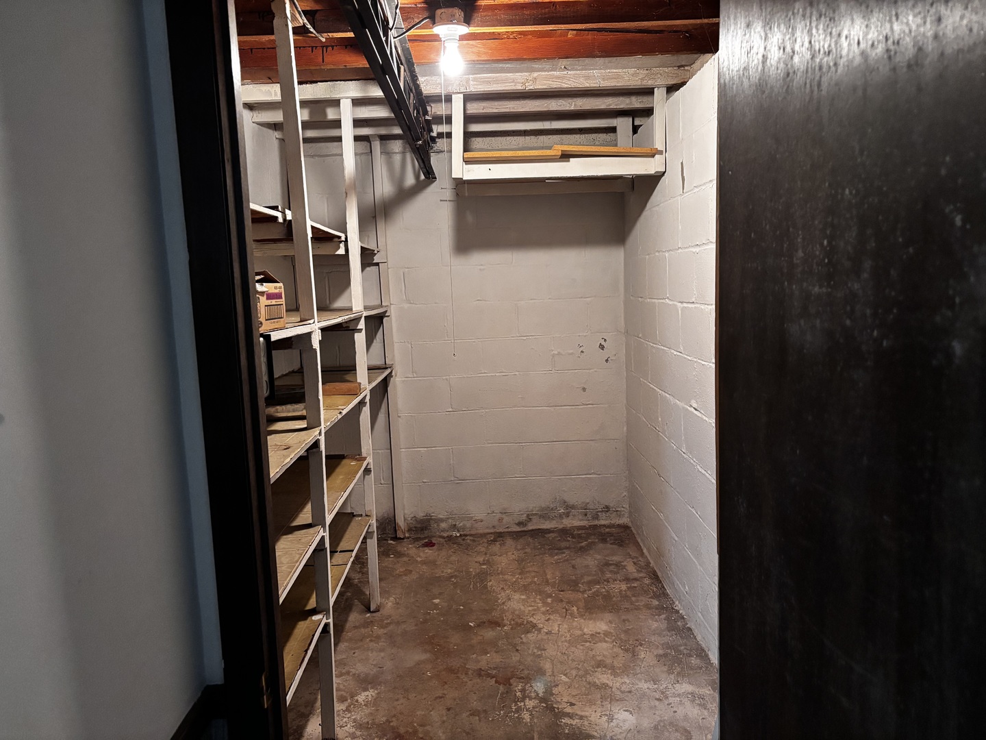 215 Cedar Street Morrison, IL 61270 - Photo 17 of 18 a view of storage and utility room with washer and dryer