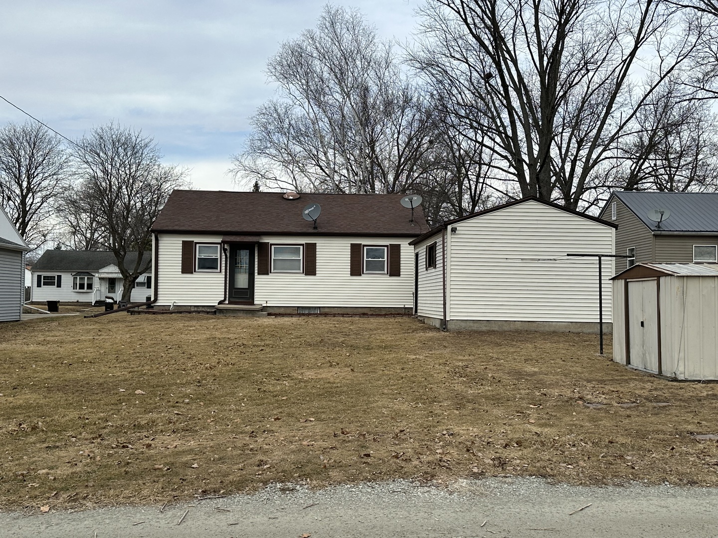 215 Cedar Street Morrison, IL 61270 - Photo 18 of 18 a front view of a house with a garden
