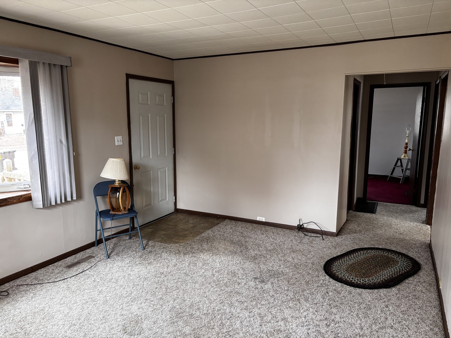 215 Cedar Street Morrison, IL 61270 - Photo 3 of 18 a view of an entryway with a carpet