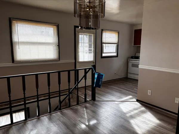 a view of a hallway with windows