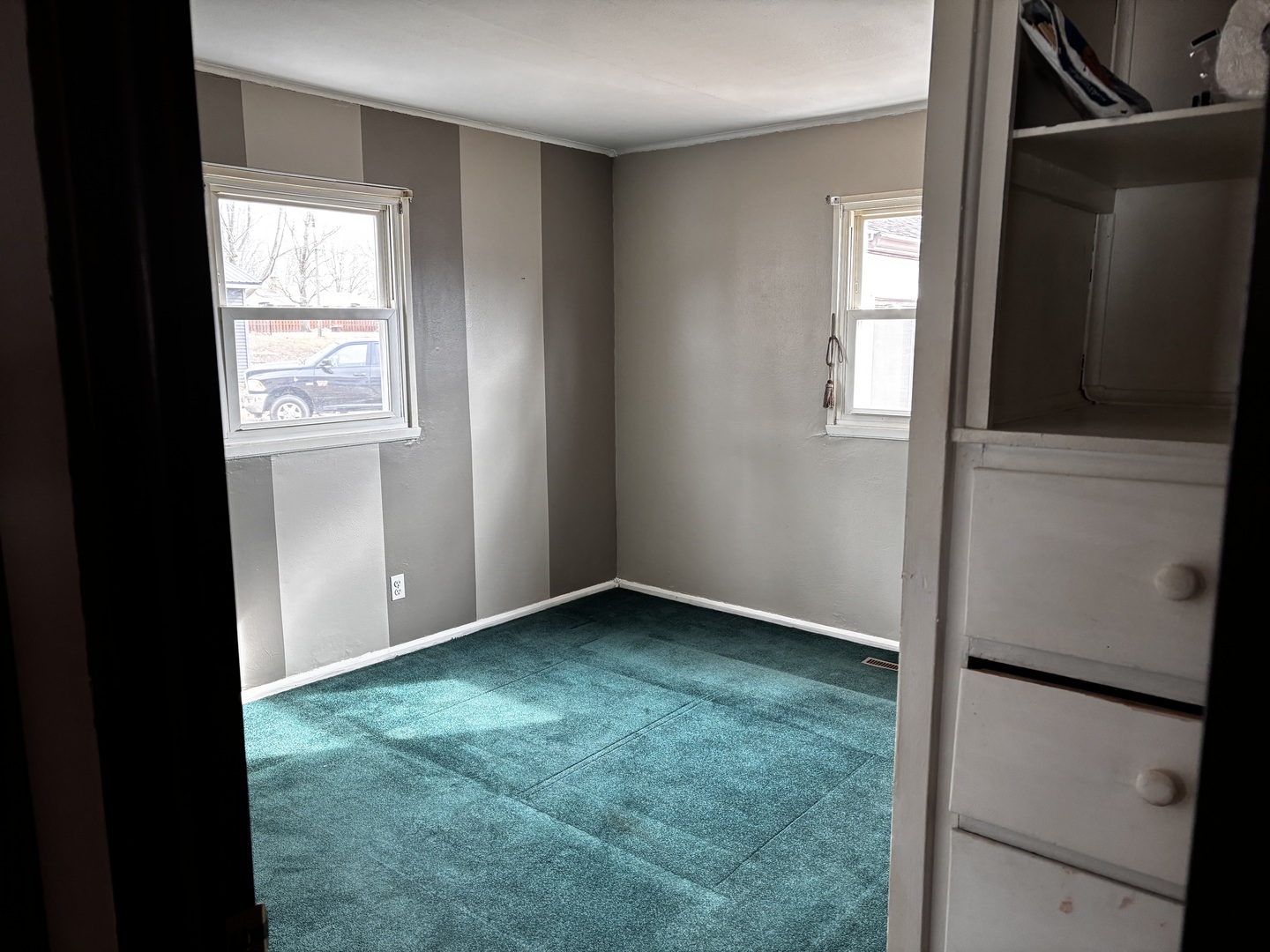 215 Cedar Street Morrison, IL 61270 - Photo 7 of 18 a view of an empty room and window