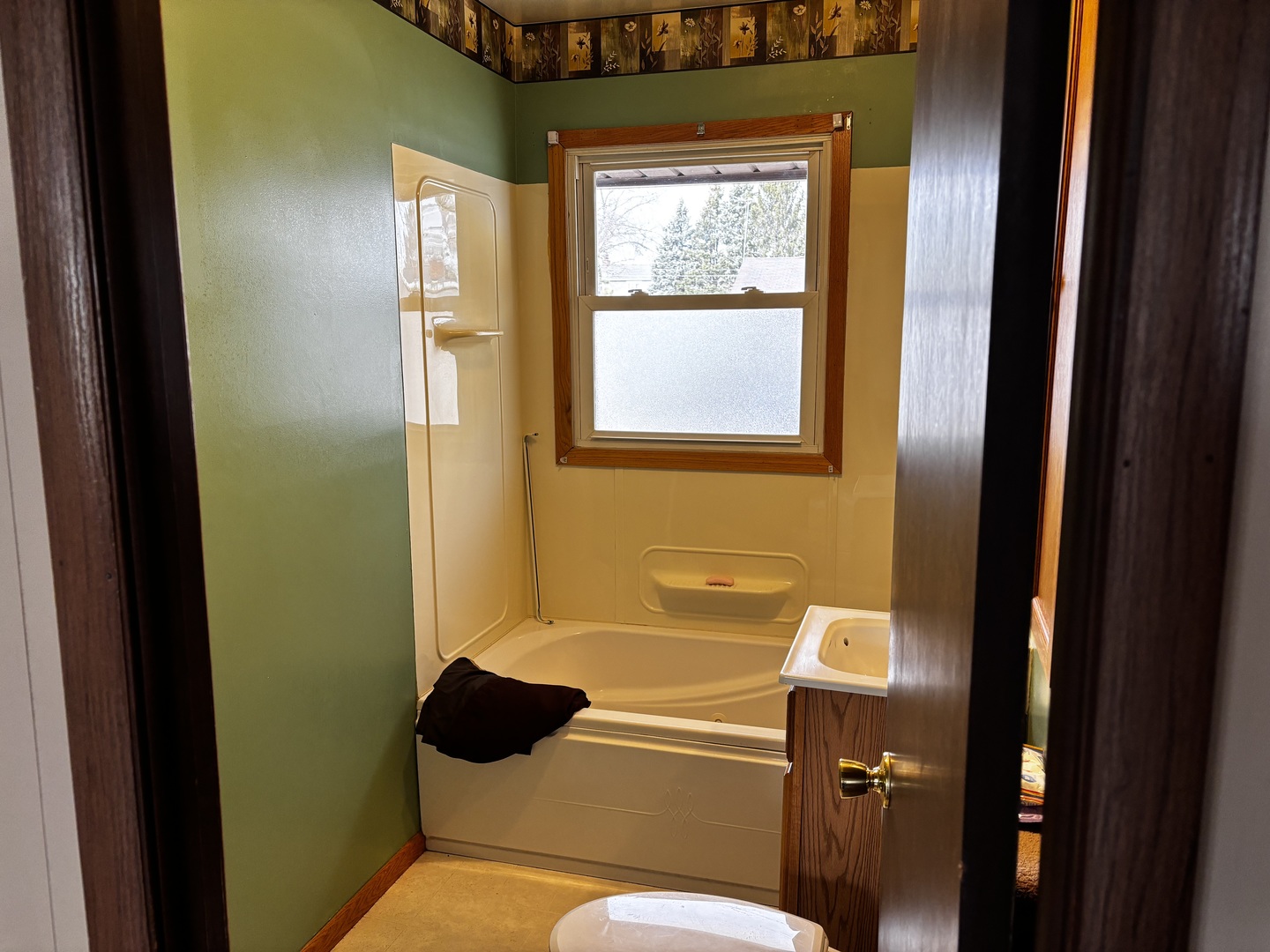 215 Cedar Street Morrison, IL 61270 - Photo 9 of 18 a bathroom with a toilet sink and mirror