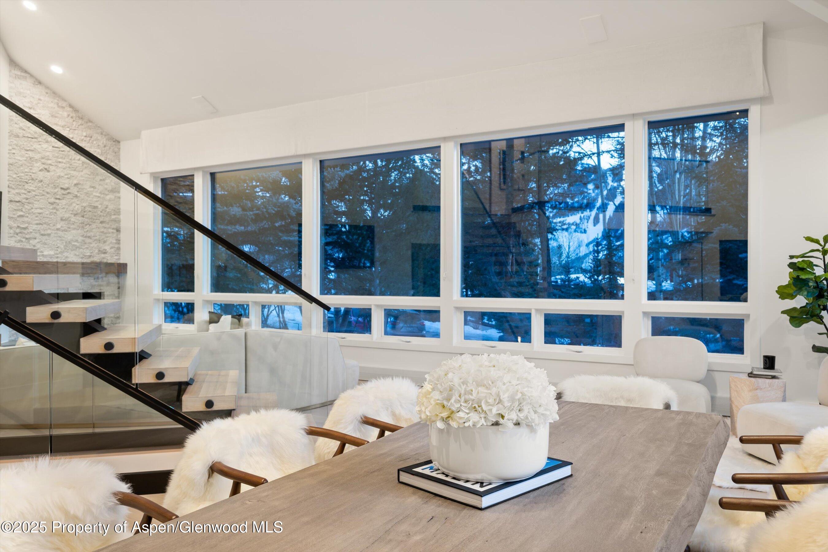 75 Bennett Court Aspen, CO 81611 - Photo 17 of 65 a living room with furniture and large windows