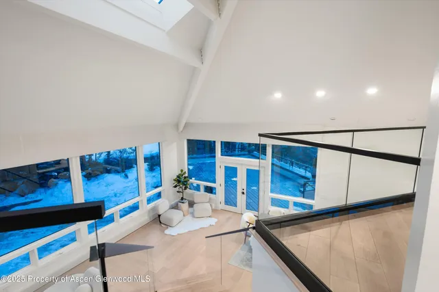 a bathroom with a granite countertop sink a toilet and shower