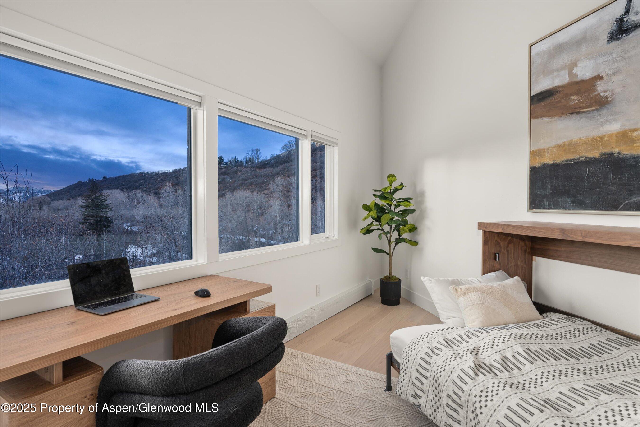 75 Bennett Court Aspen, CO 81611 - Photo 36 of 65 a bedroom with a bed and a window